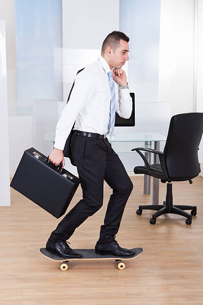 istock Businessman On Skateboard In Office 525264293
