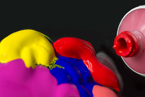 istock Four Colors of Acrylic Paint on Black 525264381