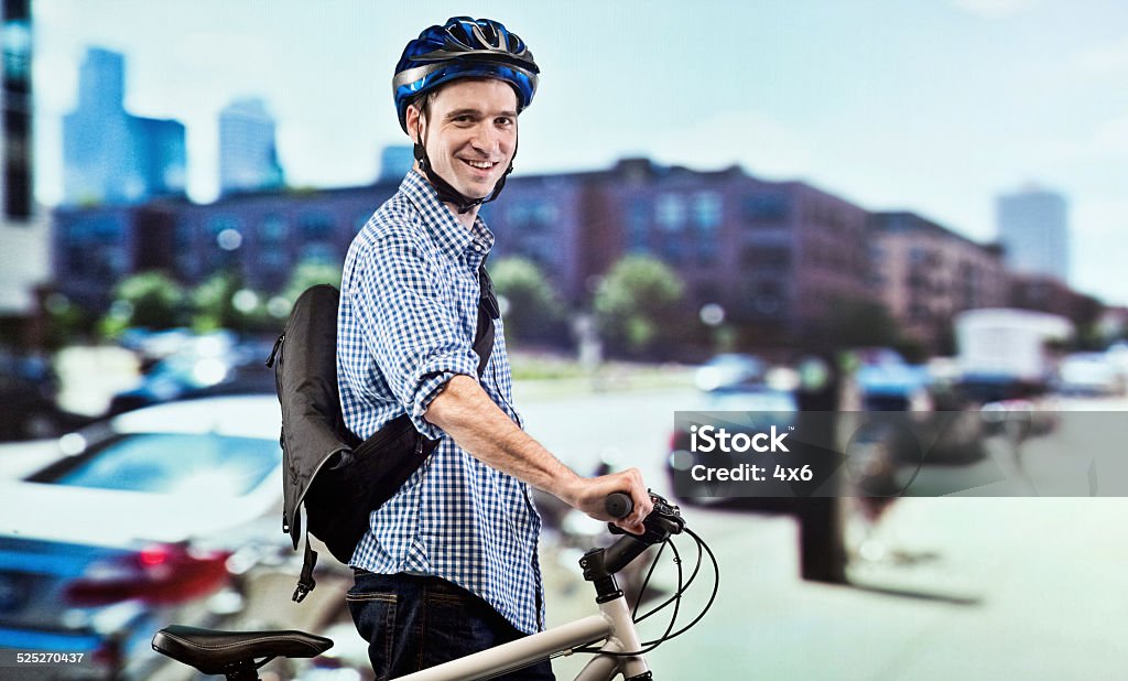 Smiling biker out in the city Smiling biker out in the cityhttp://www.twodozendesign.info/i/1.png 30-39 Years Stock Photo