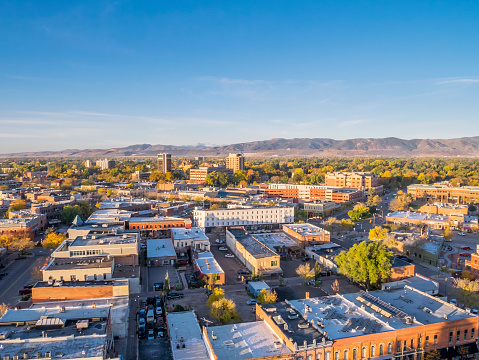 aerial view of Fort Collins downtown in sunrise light, shot from a low flying drone