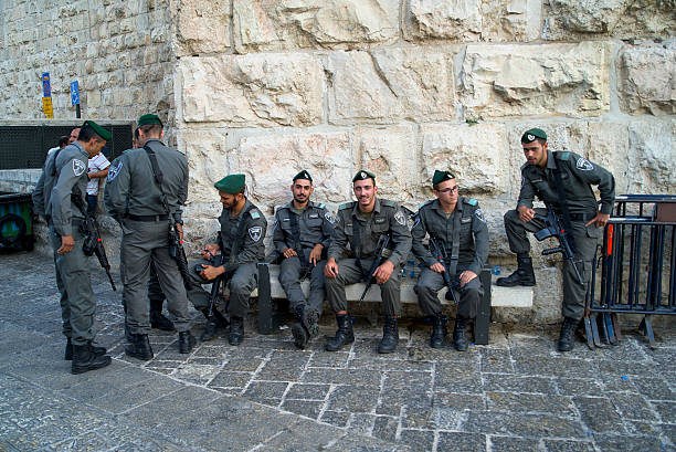 Jerusalem, Israel - October 12, 2014: Full shot of squad of Border Patrol police in the Old City of Jerusalem. 
