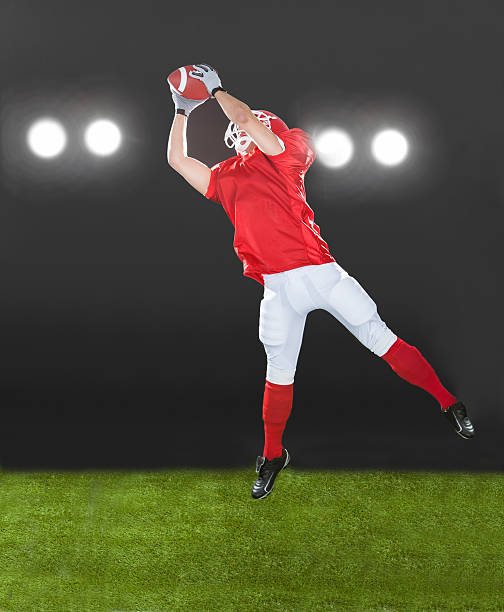 istock American Football Player Jumping On Field 525274033