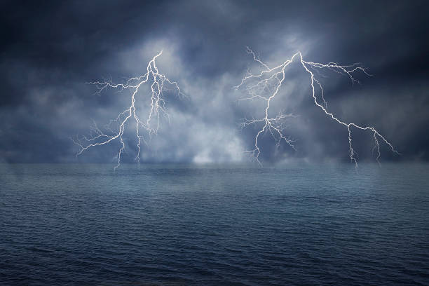 istock lightnings in dark sky and sea 525274547