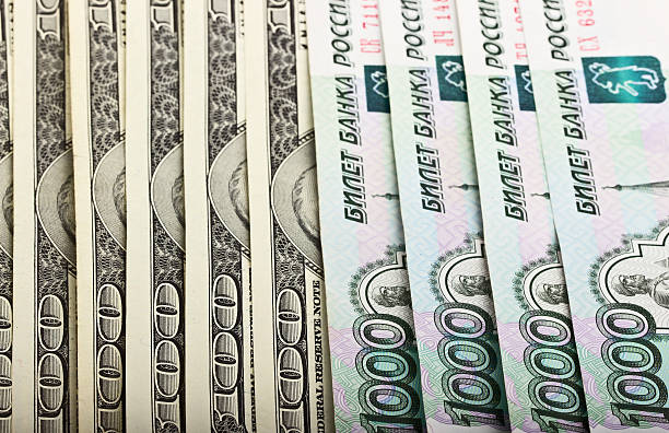 istock American dollars and Russian rubles 525274727