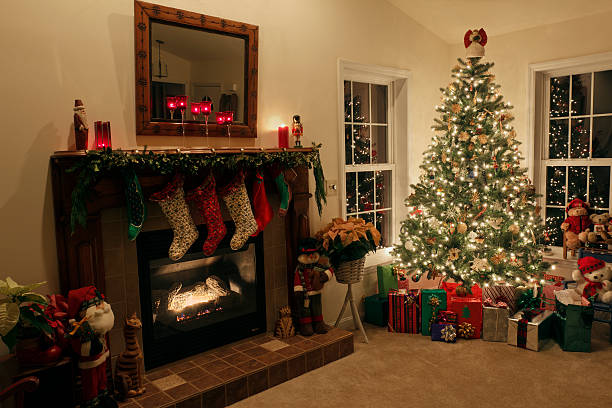 istock Christmas Eve Tree, Presents and Fireplace with Stockings 525275631