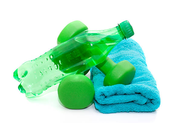 istock Dumbbells and water bottle, towel on a white background. 525276909