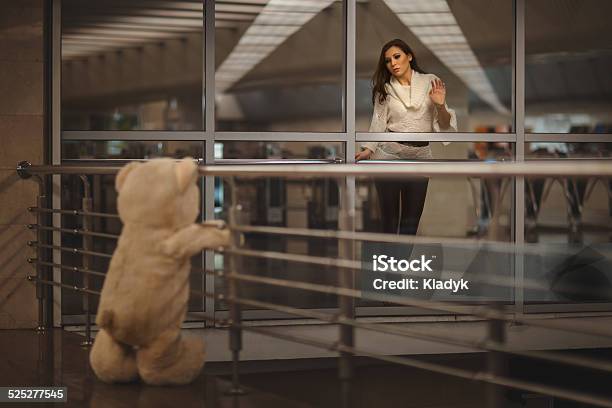 Girl Says Goodbye With A Teddy Bear Stock Photo - Download Image Now - Adult, Boredom, Child