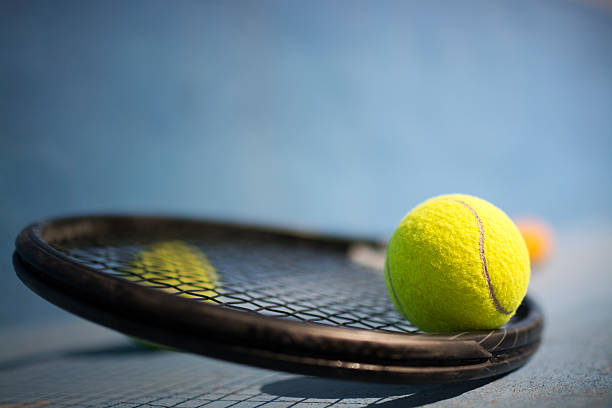 istock Tennis Ball and Racket 525298285