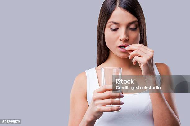 Woman Taking Pills Stock Photo - Download Image Now - Women, Taking Medicine, One Woman Only