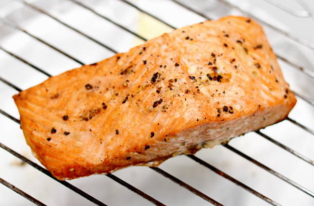 istock Grilled salmon fillet on grill, soft focus 525299809