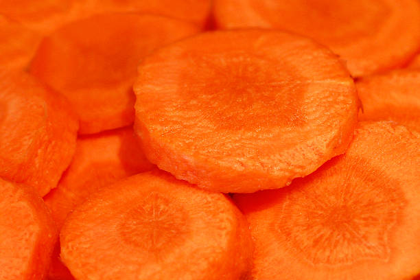 istock Fresh carrots cut into slices close-up 525301503