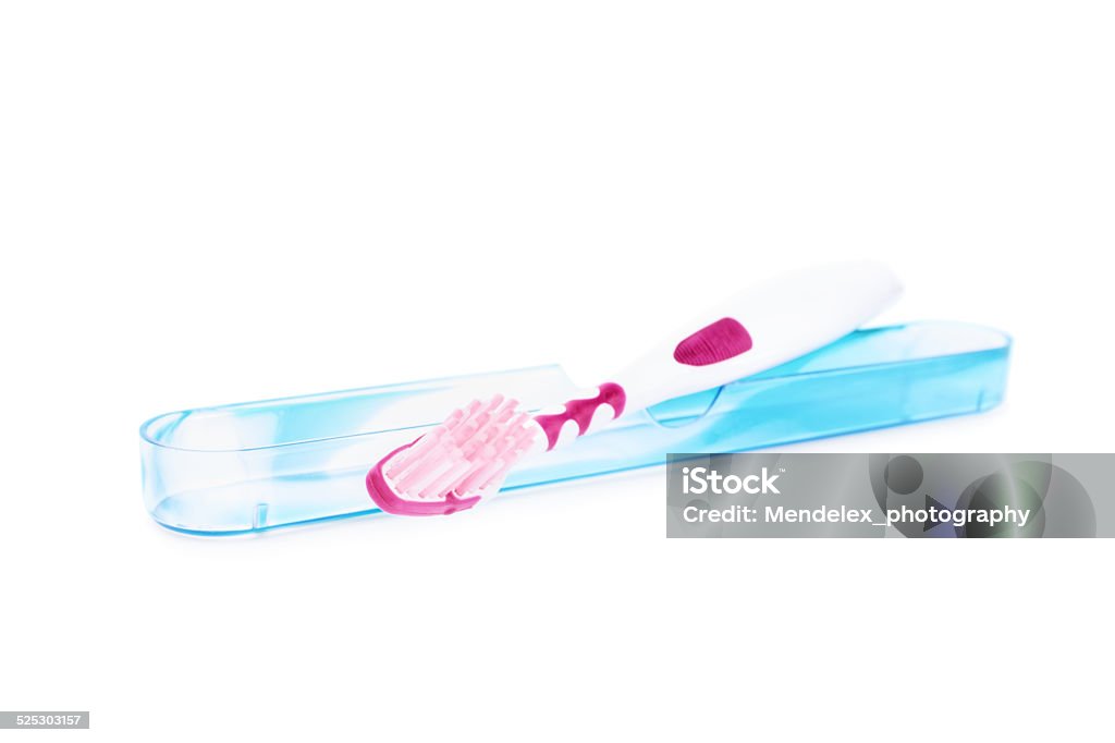 Toothbrush with a protective cover Toothbrush with a protective cover isolated on white background Toothbrush Stock Photo
