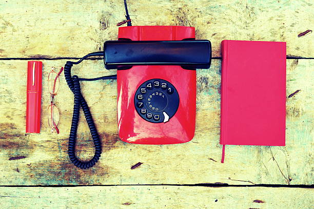 Retro rotary telephone on a wooden background
