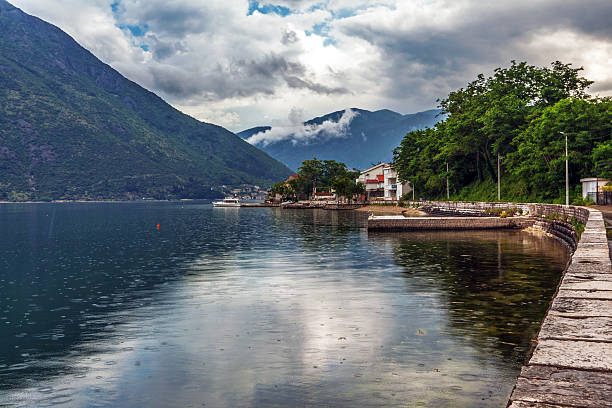 istock sea and mountains in bad rainy weather 525316475