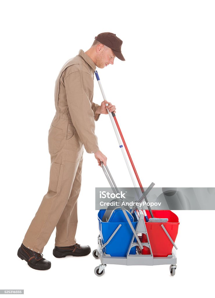 Servant With Washing Bucket And Mop Full length side view of male servant with washing bucket and mop over white background Adult Stock Photo