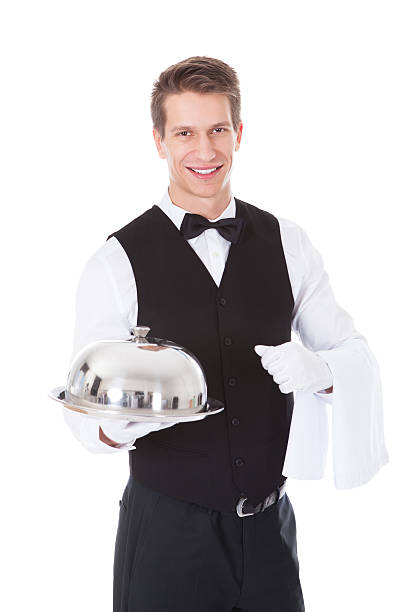 istock Waiter Holding Cloche Lid Cover 525316999