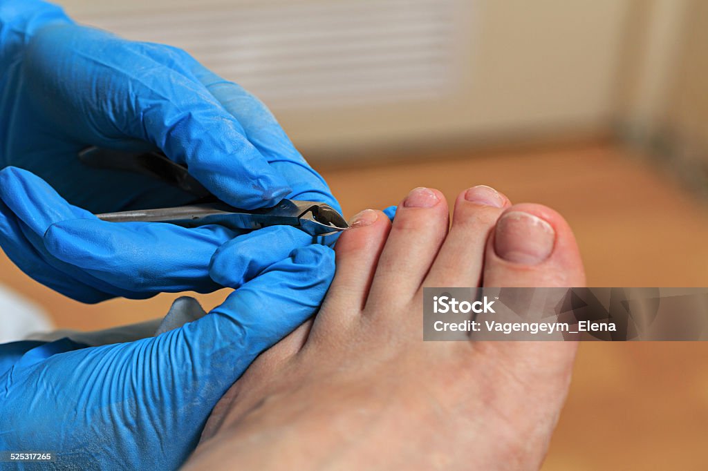 Chiropody Process pedicure close up in a fashionable spa salon, unrecognizable people Adult Stock Photo
