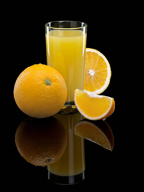 istock Glass of orange juice with fruit 525317989