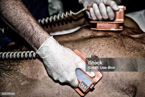 Cardiac Defibrillation Stock Photo - Download Image Now - Defibrillator, Accidents and Disasters, Adult