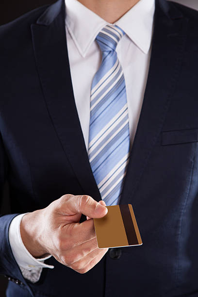 istock Businessman Showing Credit Card 525320275