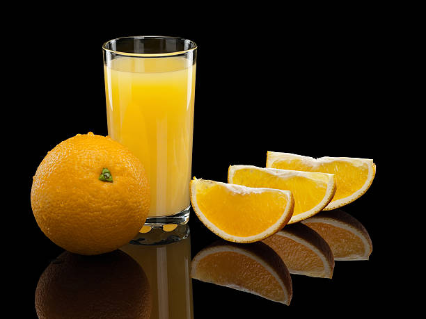 istock Glass of orange juice with fruit 525320683