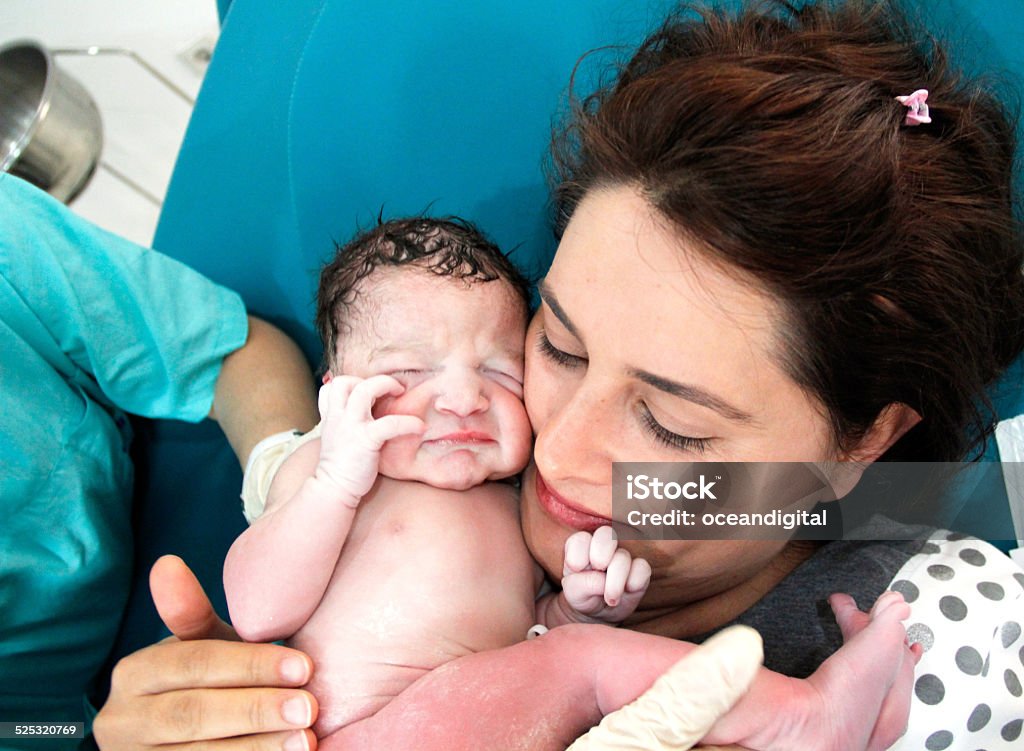 Newborn and Mother in hospital Midwife Stock Photo