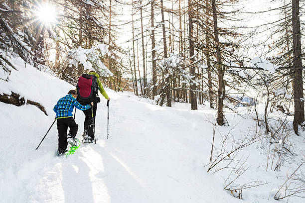 istock Mother and Son Snowshoeing 525320955