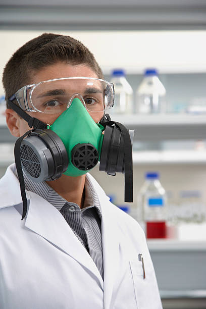istock Scientist Wearing Gas Mask In Laboratory 525321515