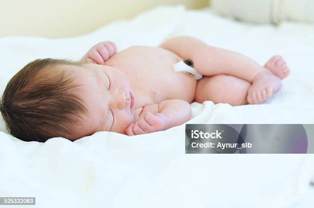 Newborn Baby With Umbilical Cord Sleeping Undressed Stock Photo - Download Image Now