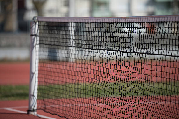 istock Tennis Court Net and Court Beyond 525322627
