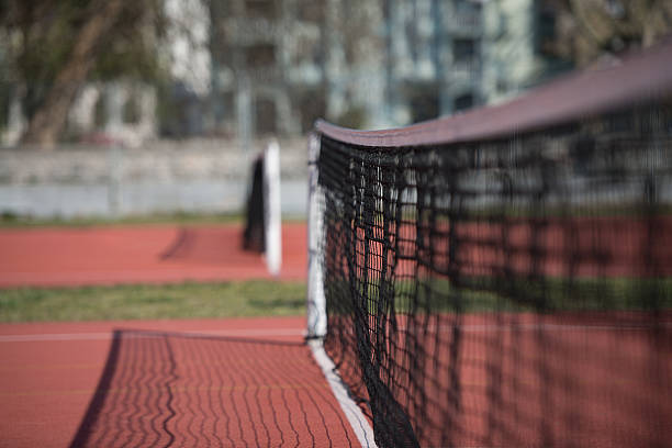 istock Tennis Court Net and Court Beyond 525322641