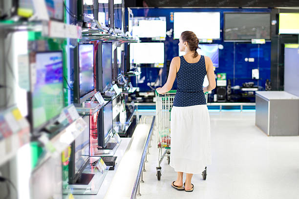 istock woman buys the TV 525323437