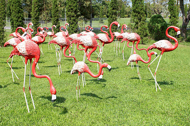 istock Red flamingos statue in the park background 525325887