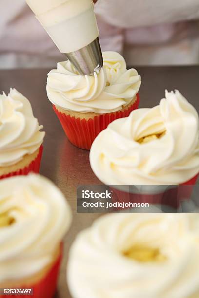 Whipped Butter Cream Frosting Applied To Cupcakes Stock Photo - Download Image Now - Baked Pastry Item, Bakery, Baking