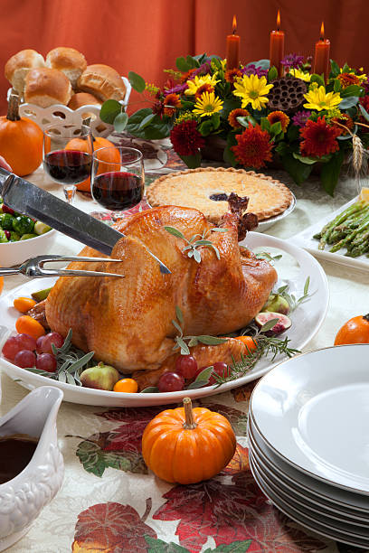 istock Carving Roasted Turkey on Harvest Table 525327059