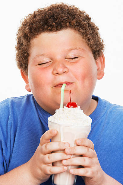 Overweight Child Eating Junk Food