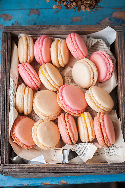 istock French macarons in a wooden box, selective focus 525327847