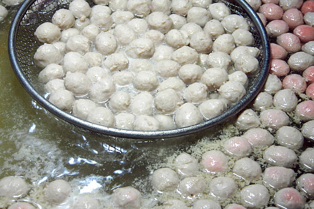 Boiling meat ball in hot water stock photo