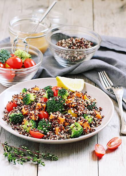 istock Quinoa salad with broccoli,sweet potatoes and tomatoes 525336448