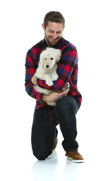 istock Smiling man embracing with his dog 525336806