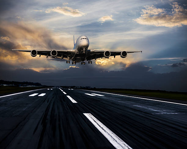 istock Passenger airplane landing at dusk 525337962