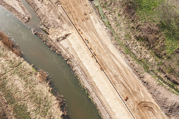 istock aerial view of  over the  river and harvest fields 525338596