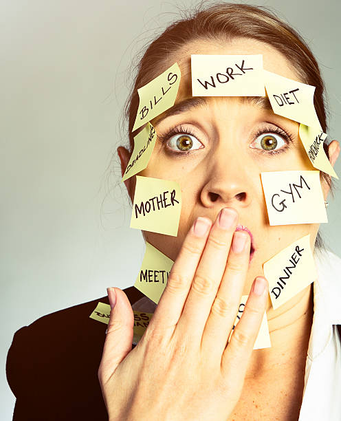 istock Shocked woman covered in task-reminder adhesive notes 525338986