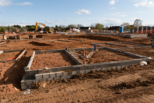 Exeter,England - April 27, 2016: A building site at an early stage with foundations laid and walls being started with 