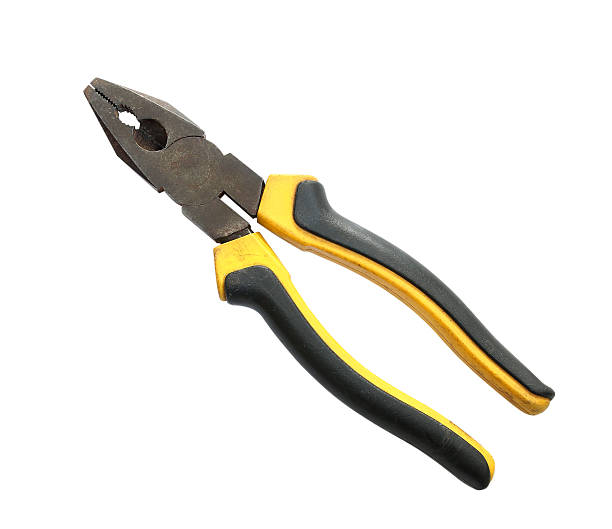 istock Old and dirty pliers yellow on white background. 525339519