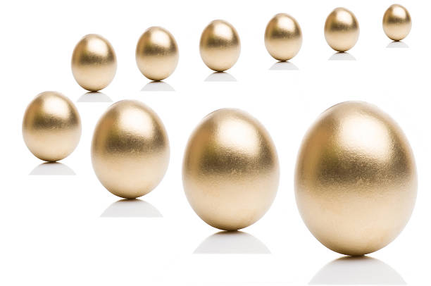 istock Golden eggs from  isolated on a white background. 525341254