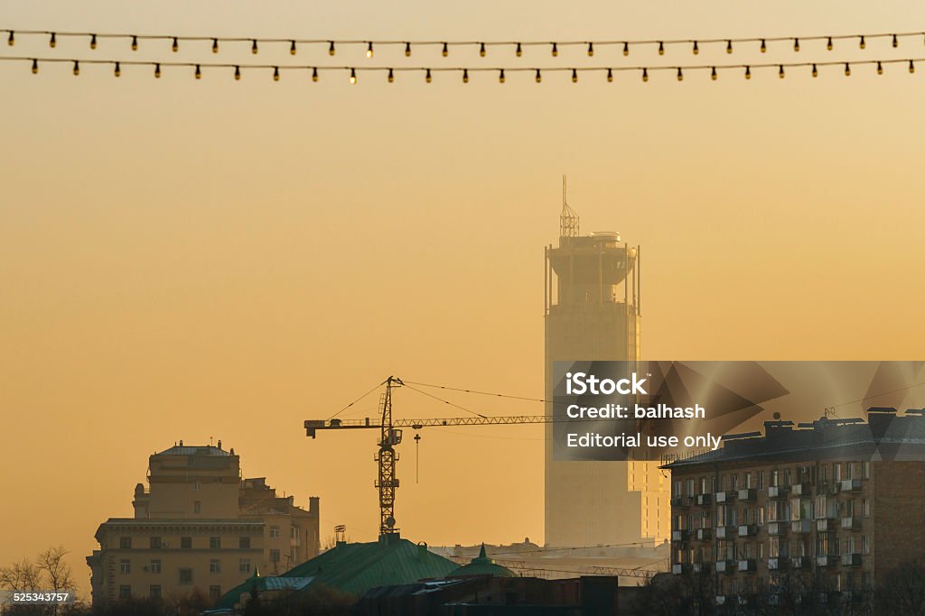 Swissotel Krasnye Holmy of Moscow in smog Moscow, Russia - November 20, 2014: Smog in Moscow, Russia. Thursday, Nov. 20, 2014. Weather: Sun, smog and frost in Moscow, Russia. The temperature is rather cold, up to -11°C (12.2°F). Either cloudy or sunny, no snow at all and practically no wind. So smog rules the day and transport adds its exhaust gas to the city air on top of everything else. Swissotel Krasnye Holmy of Moscow in smog Air Pollution Stock Photo