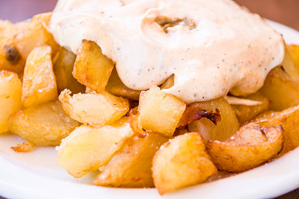 typical spanish patatas bravas, spicy potatoes