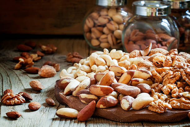 istock Brazilian nut, nut mix, vintage wooden background 525343904