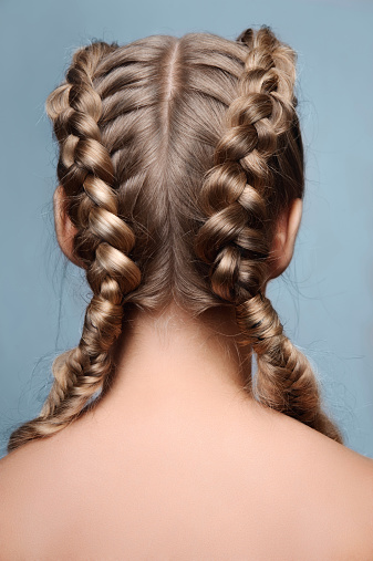 Beauty female model with braids from back